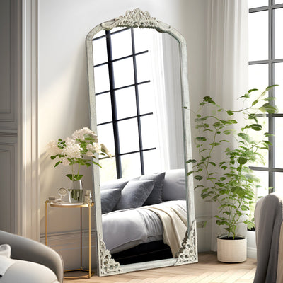 Miroir de sol sculpté en bois massif de forme arquée sur toute la longueur