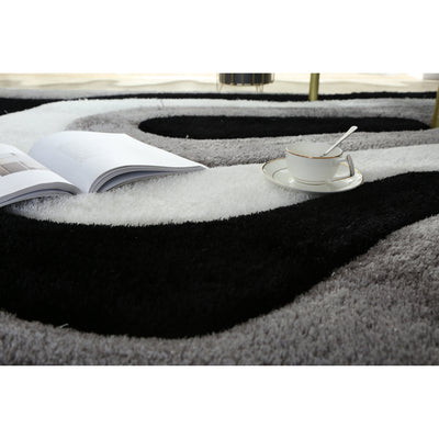Tapis à poils longs Mateos au design abstrait
