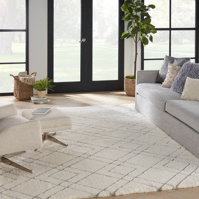Tapis Nourison luxueux à poils longs et ultra moelleux, motif géométrique abstrait