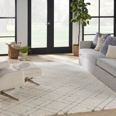 Tapis Nourison luxueux à poils longs et ultra moelleux, motif géométrique abstrait